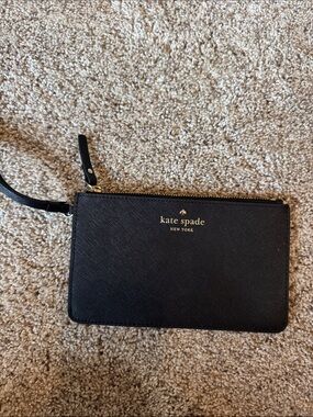 kate spade black saffiano wristlet with gold logo